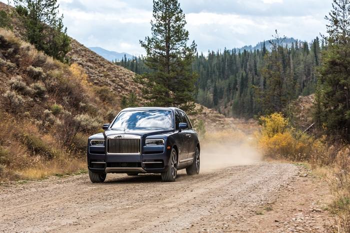 Luxury Rolls-Royce Cullinan SUV on a dusty road