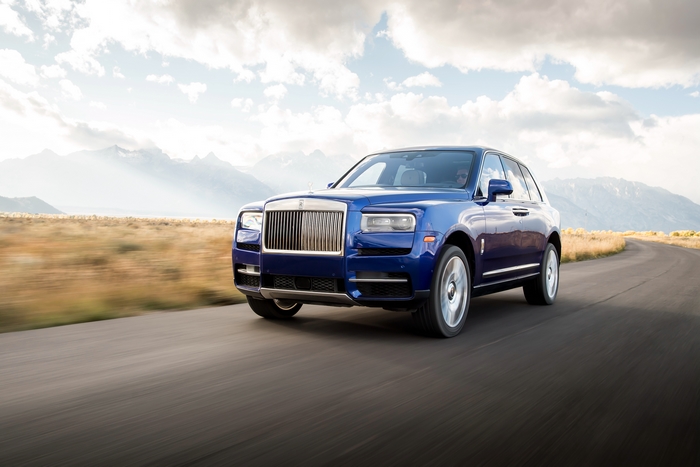 Rolls-Royce Cullinan 4K luxury SUV driving on a mountain road