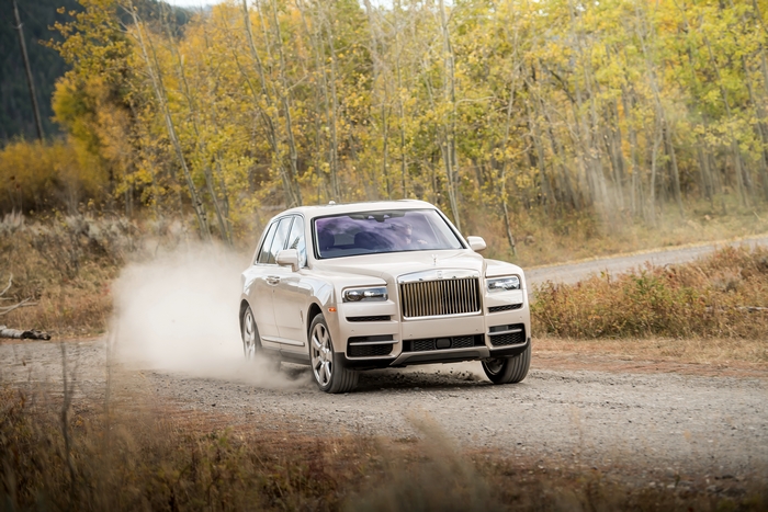 Rolls-Royce Cullinan SUV Kicking Up Dust on Dirt Road