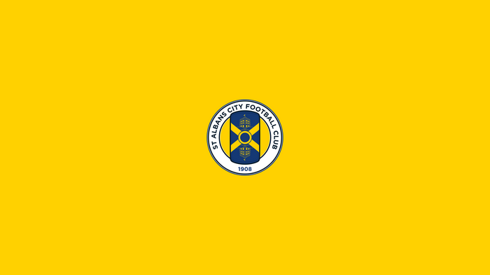 St Albans City F.C. logo on yellow background