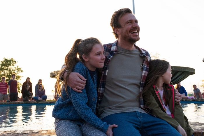 Jason Segel with two girls from Our Friend