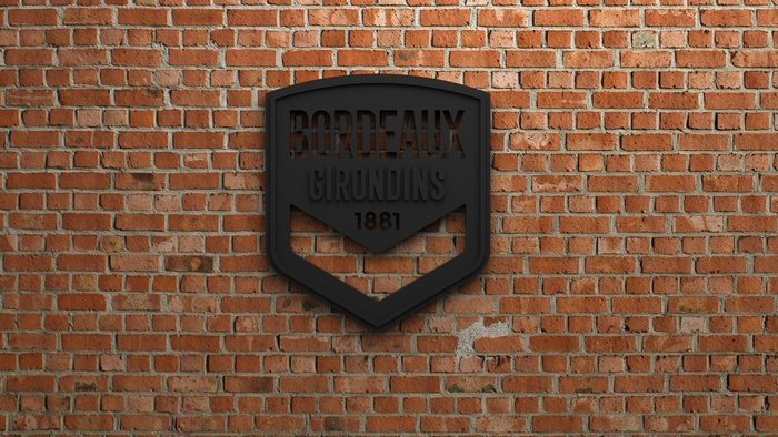 FC Girondins De Bordeaux emblem on brick wall