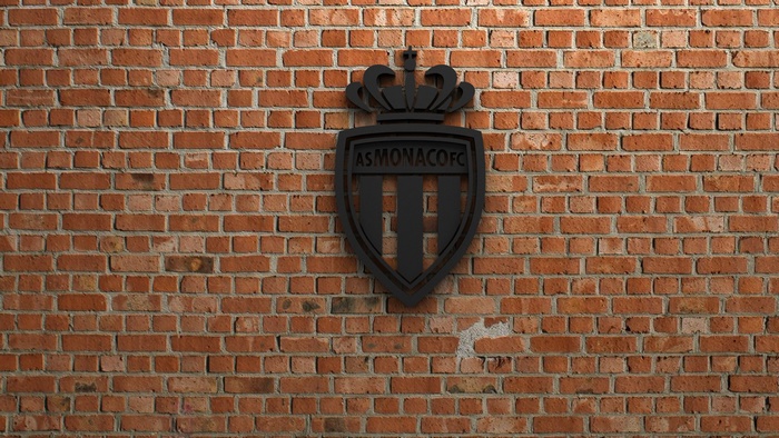 AS Monaco FC Logo on Brick Wall
