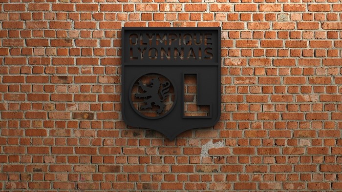 Olympique Lyonnais emblem on brick wall