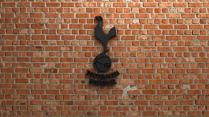 Tottenham Hotspur Emblem on Red Brick Wall
