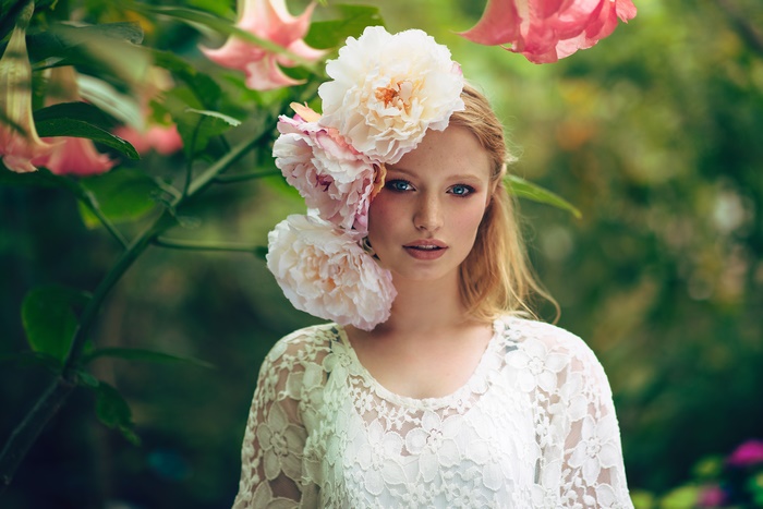 Girl with White Flower Wreath and Blue Eyes
