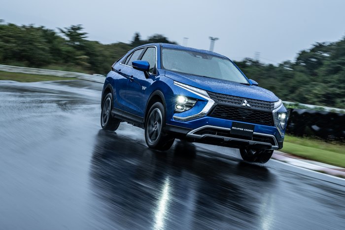 Mitsubishi Eclipse Cross SUV driving in rain on track 4K