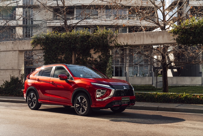 Red Mitsubishi Eclipse Cross SUV on urban street