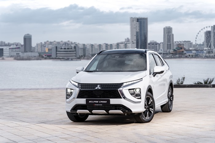 White Mitsubishi Eclipse Cross SUV by the water