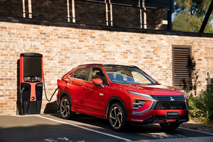 Red Mitsubishi Eclipse Cross PHEV SUV charging