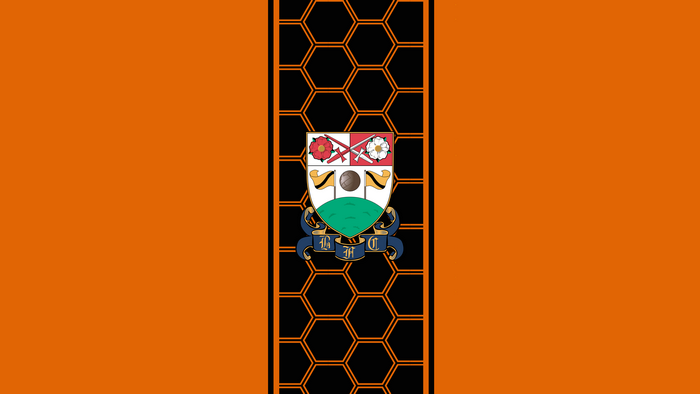 Barnet F.C. Emblem on Orange Honeycomb Design