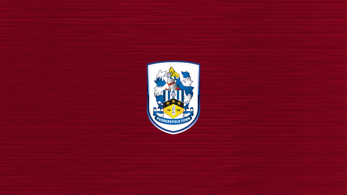 Huddersfield Town A.F.C. Emblem on Red Textured Background