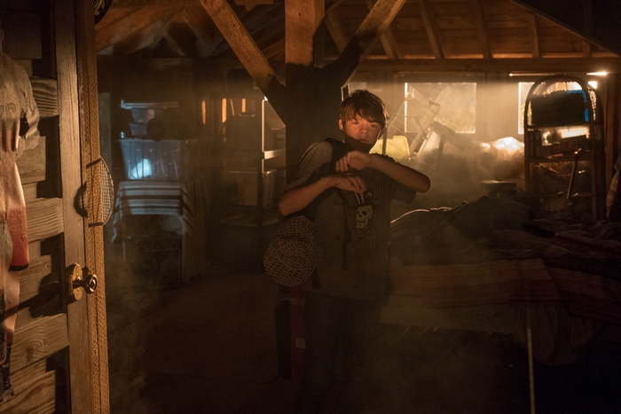 Oakes Fegley in a dusty attic from The War With Grandpa