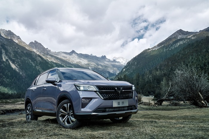 2021 Wuling Xingchen SUV in a cloudy mountain valley