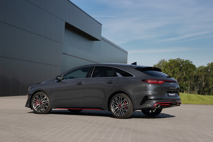 Dark grey Kia ProCeed GT parked by modern building