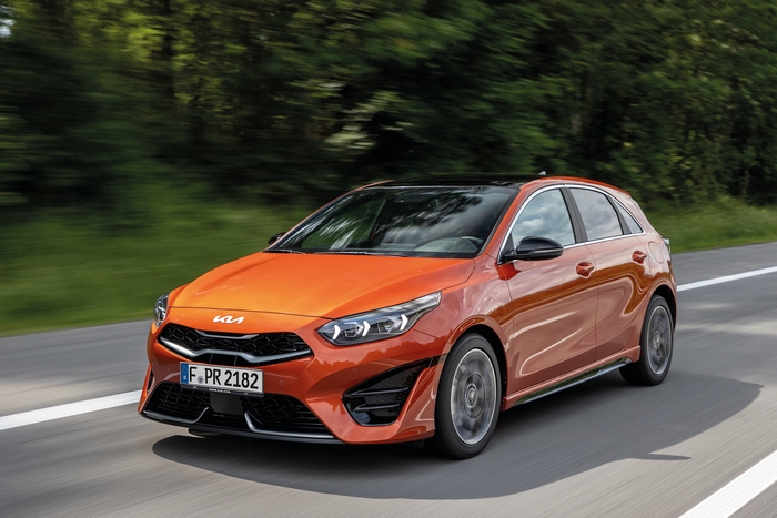 Orange 2021 Kia Ceed GT-Line driving on road