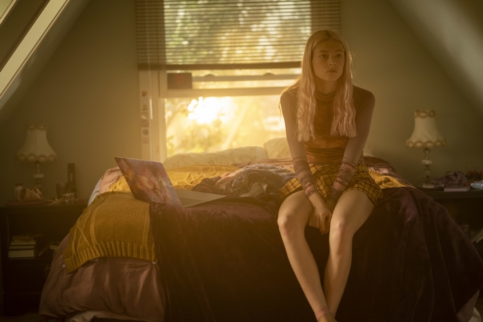 Hunter Schafer as Jules sitting on bed, Euphoria