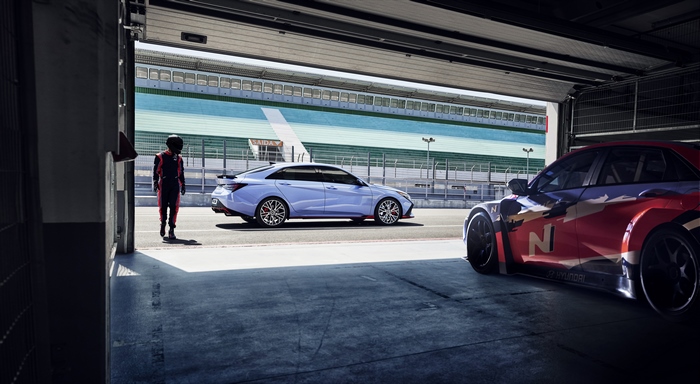 Hyundai Elantra N and N race car in track garage