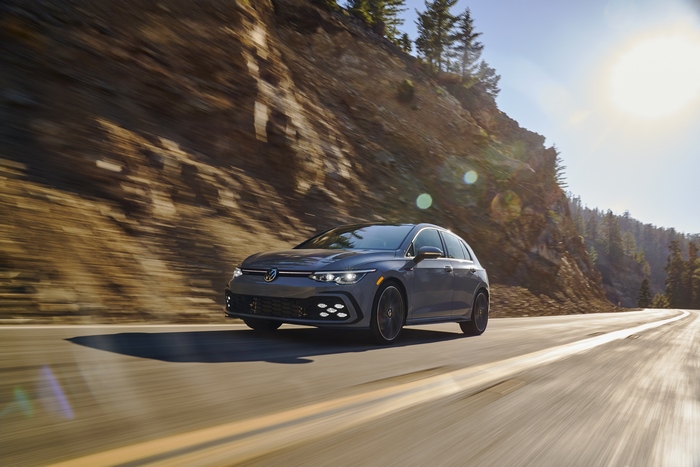 2022 Volkswagen Golf GTI on a sunny mountain road