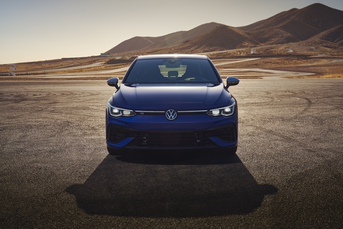 Blue 2022 Volkswagen Golf R on a desert track