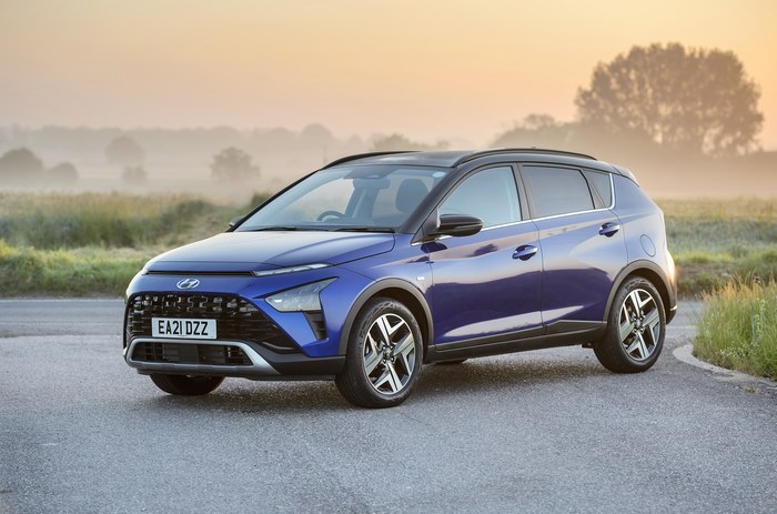 Blue 2021 Hyundai Bayon SUV at misty sunrise