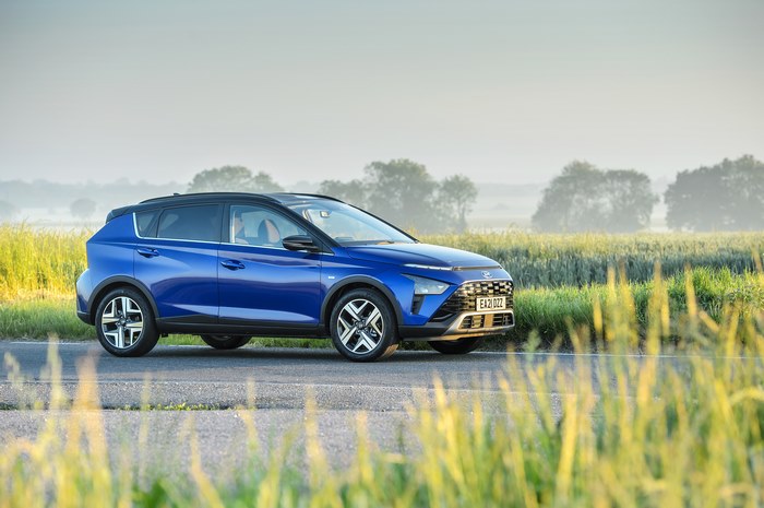 Blue 2021 Hyundai Bayon SUV on a country road