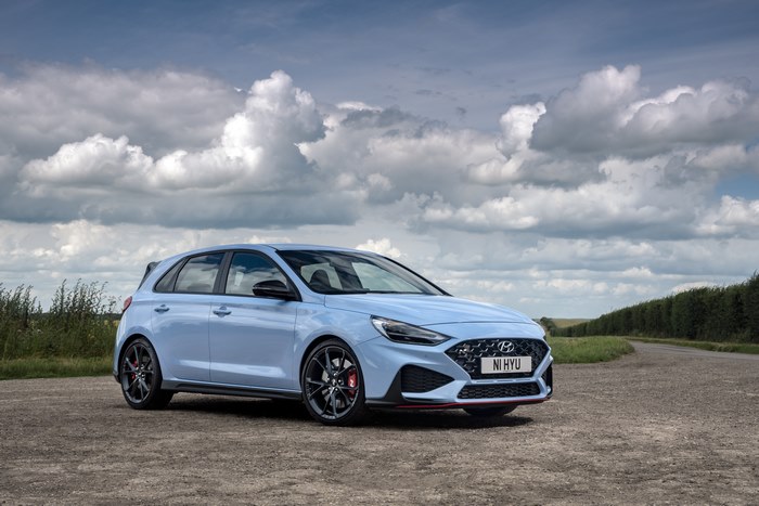 Light blue Hyundai i30 N on a country road