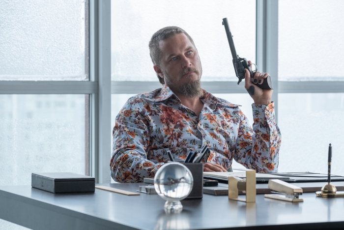 Travis Fimmel in Die In A Gunfight holding a gun