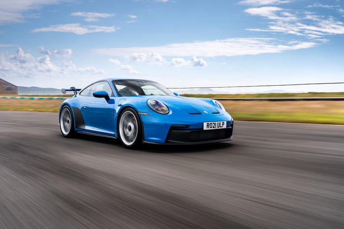 Blue 2021 Porsche 911 GT3 MT on a race track