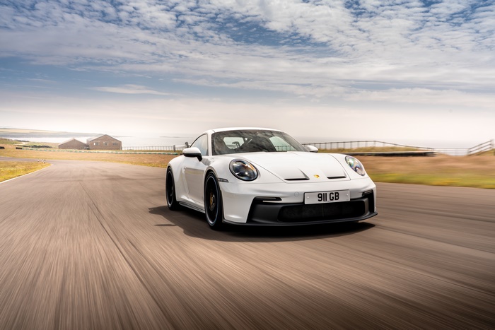 White 2021 Porsche 911 GT3 PDK on a race track