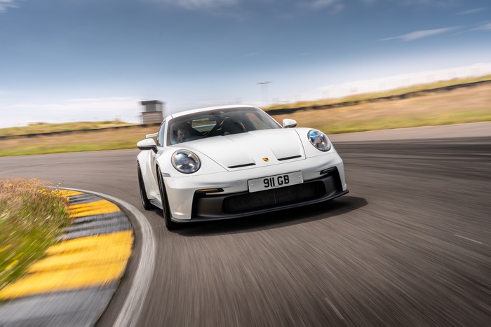 White Porsche 911 GT3 on a race track