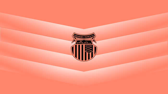 Grimsby Town FC logo on a coral chevron background