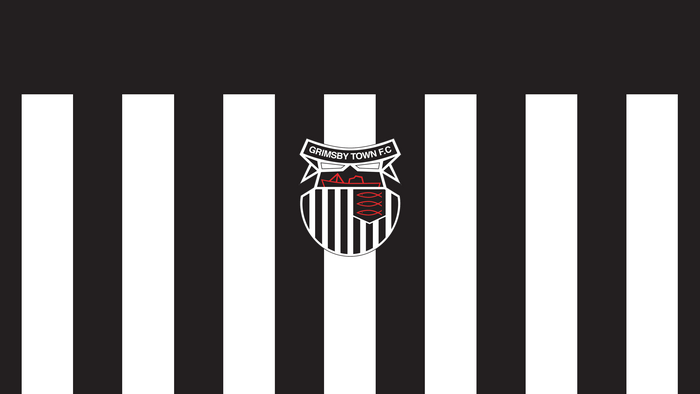 Grimsby Town F.C. logo on black and white stripes