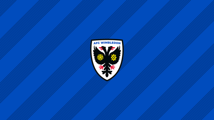 AFC Wimbledon logo on blue striped background
