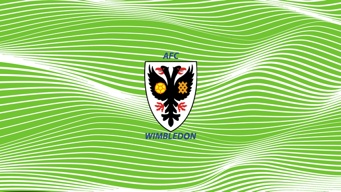 AFC Wimbledon logo on a green wavy background