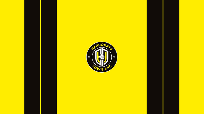 Harrogate Town AFC logo on yellow and black stripes