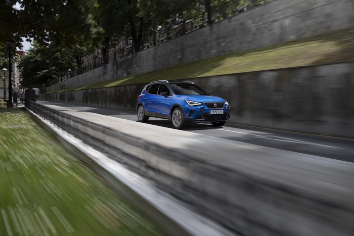 Blue 2021 SEAT Arona FR SUV driving on road