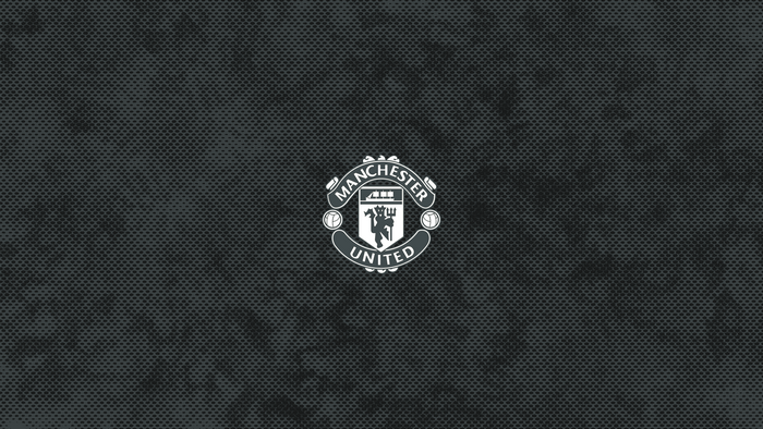 Manchester United F.C. logo on a dark textured background