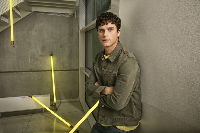 Adam Pålsson actor leaning against wall