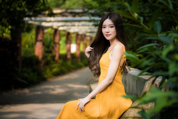 Asian model in yellow dress with black hair