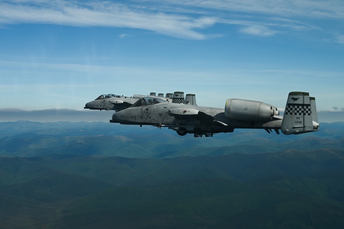 A-10 Thunderbolt II "Warthog" fighter jets flying over mountains