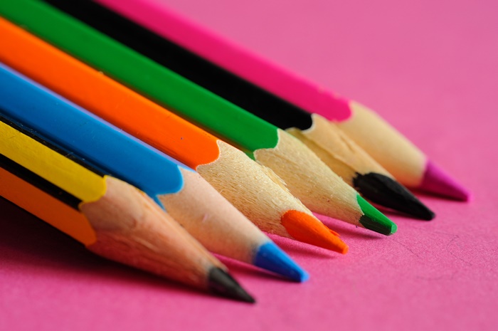 Macro photography of colorful pencils on pink background