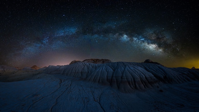 Milky Way over desert landscape at night