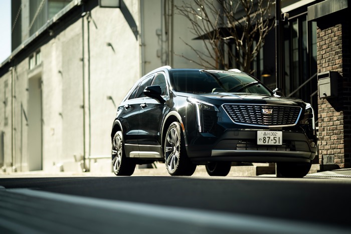 Black Cadillac XT4 350T Sport SUV on street