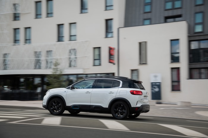 White Citroën C5 Aircross SUV Hybrid driving on street
