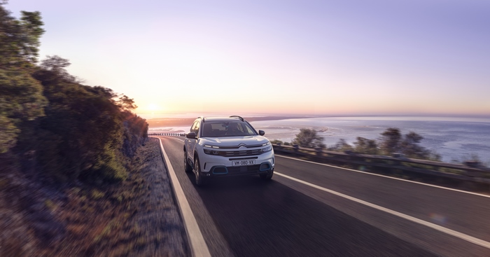 White Citroën C5 Aircross SUV Hybrid driving on coastal road