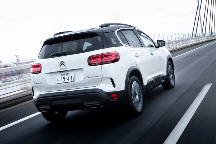 White 2021 Citroën C5 Aircross SUV Hybrid driving on bridge