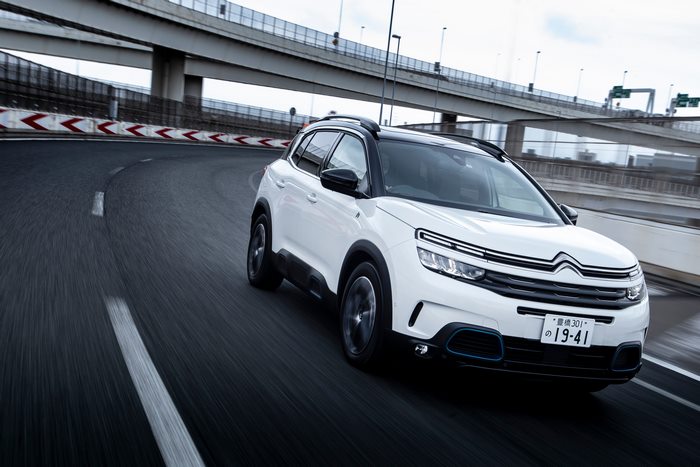 White 2021 Citroën C5 Aircross SUV Hybrid driving on highway