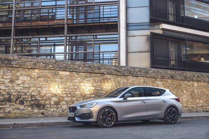 Silver 2021 Cupra Leon VZ3 parked by a stone wall