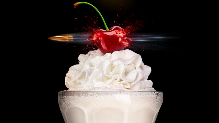 Gunpowder Milkshake: Bullet hitting a cherry on whipped cream